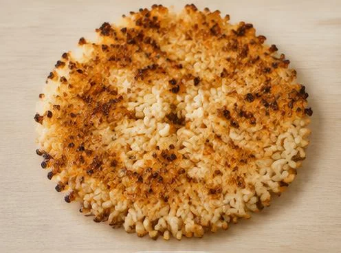 Korean crungji crisp rice snack on a wooden board